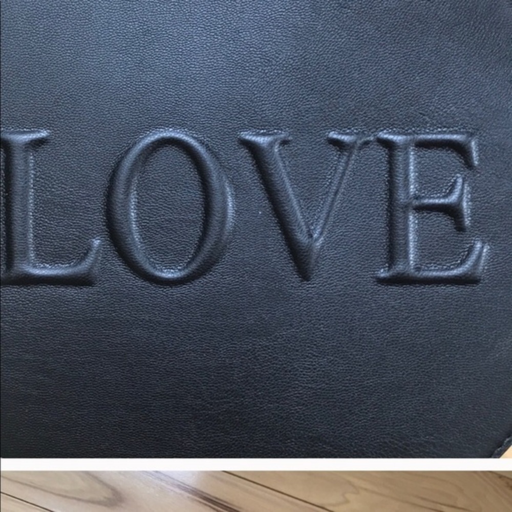 Embossed cross body.